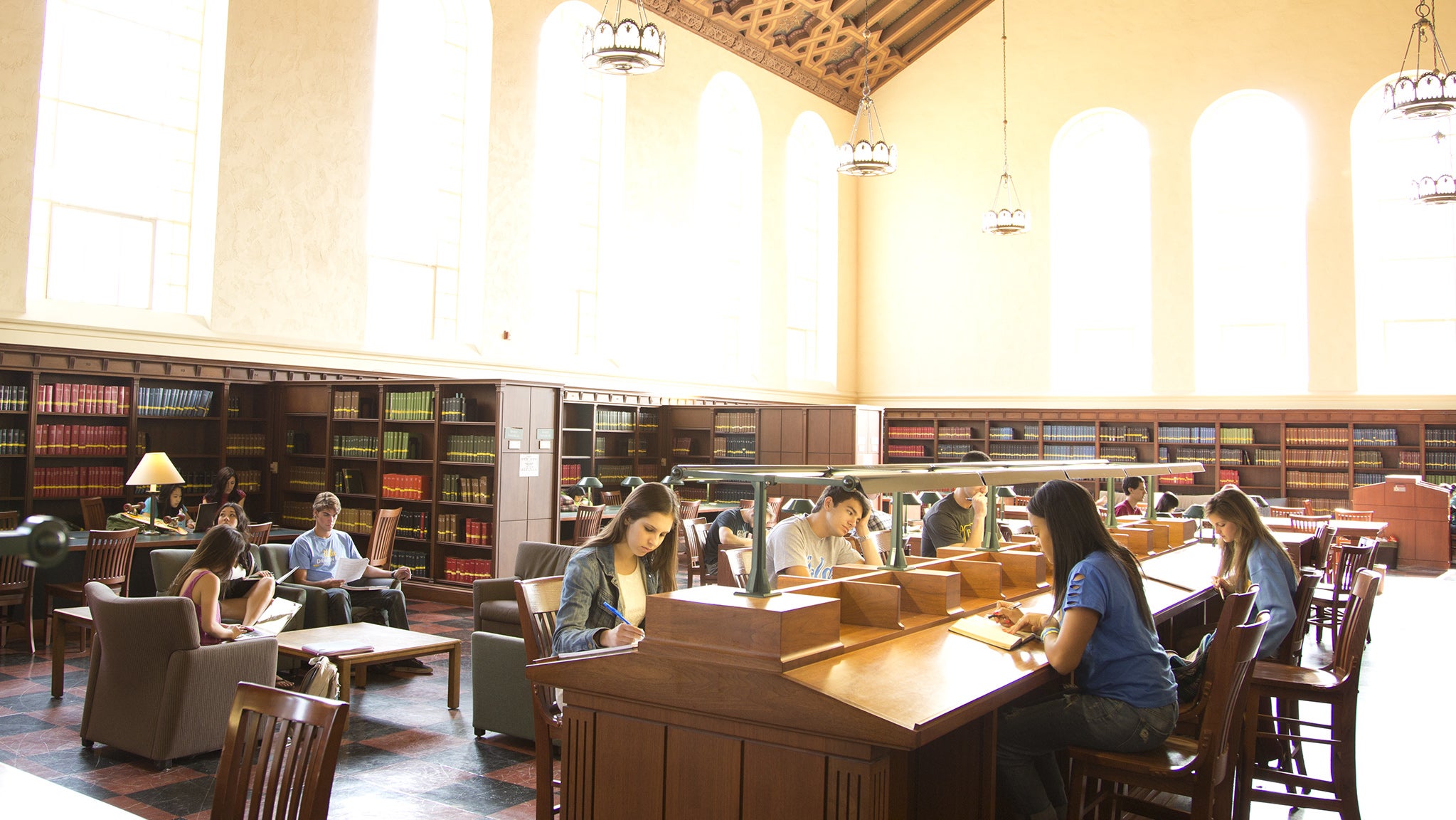 Students study in Powell Library, the main undergraduate library on campus.