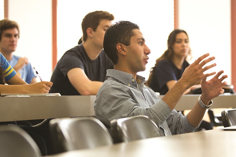 A student voices his opinion in a small interdisciplinary course.