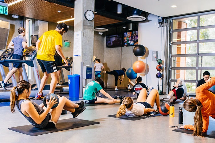 Students work out and lift weights in one of the many sports facilities.