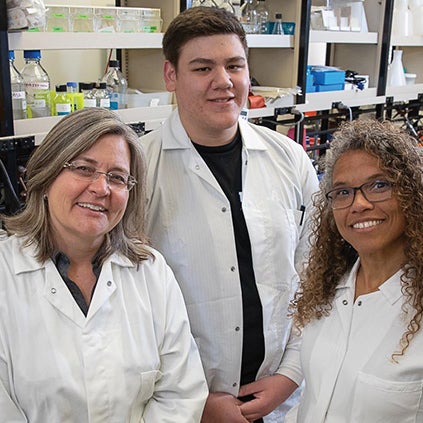 UCLA student José Gonzalez, who does autism research, poses with coworkers in the lab.