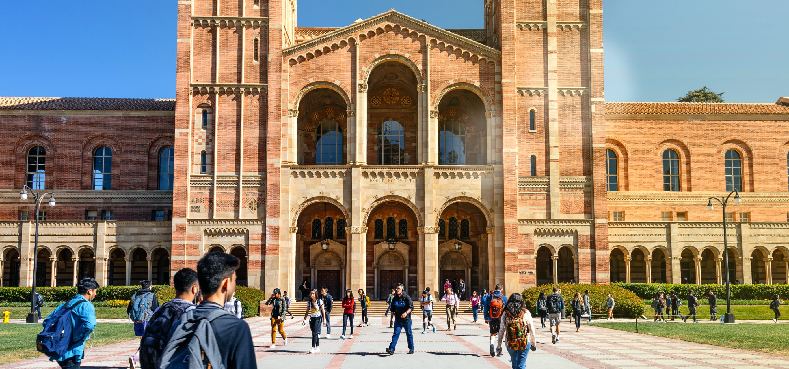 Students make their way across Dickson Plaza on a sunny day on campus