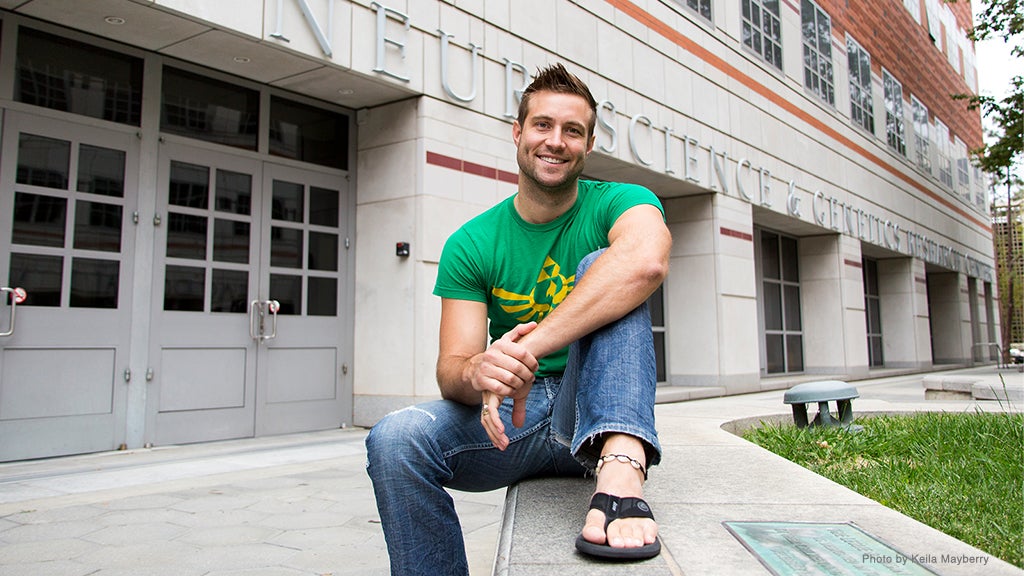 Former neuroscience grad student Don Vaughn smiles outside a neuroscience research center.