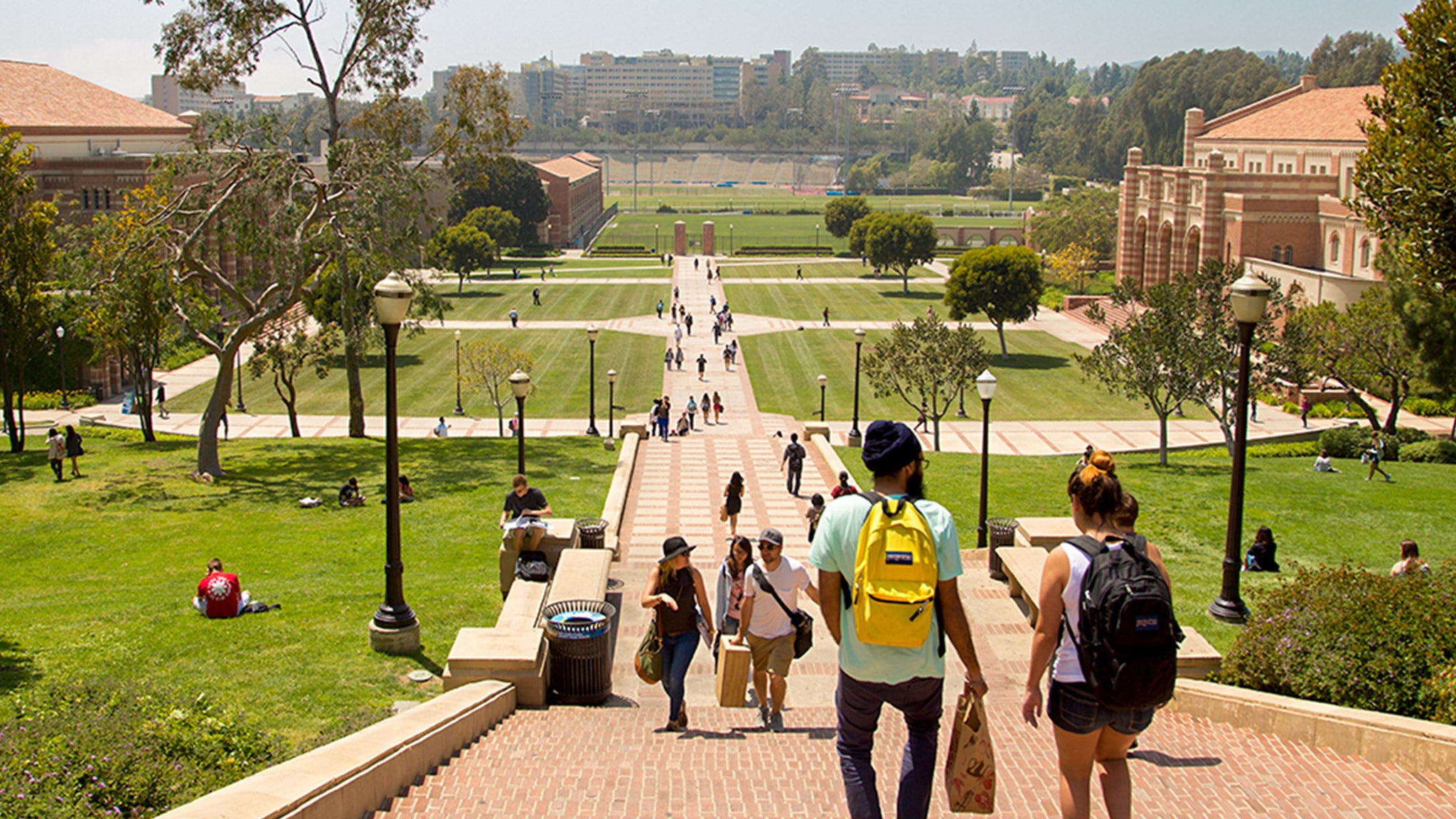 Students head down Janss Steps and enjoy the sun on Wilson Plaza.