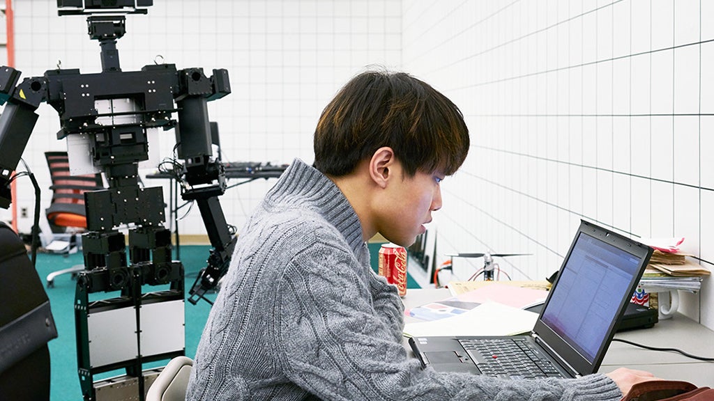 A student works in the Robotics and Mechanisms Lab.