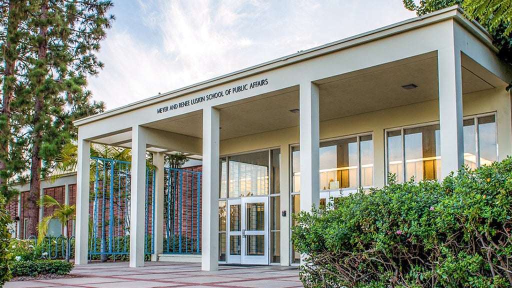 Glass doors and windows brighten the entryway of the UCLA Luskin School of Public Affairs. 