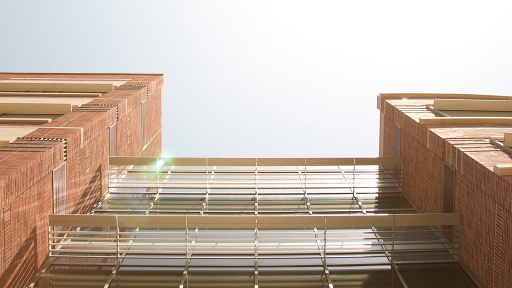 The sun reflects off the façade of the UCLA Terasaki Life Sciences Building.