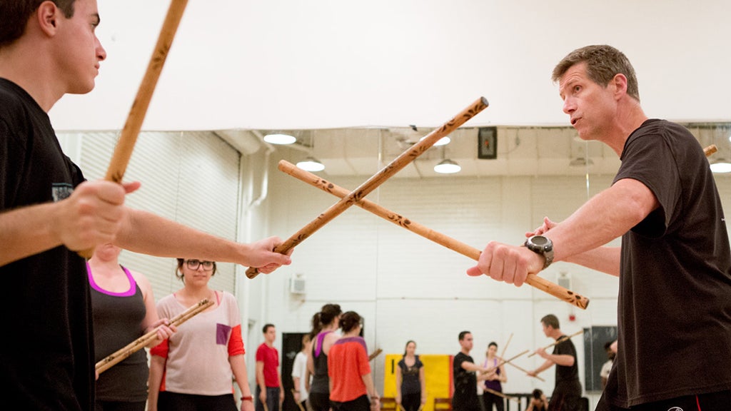 Theater students learn martial arts moves to build physical awareness.