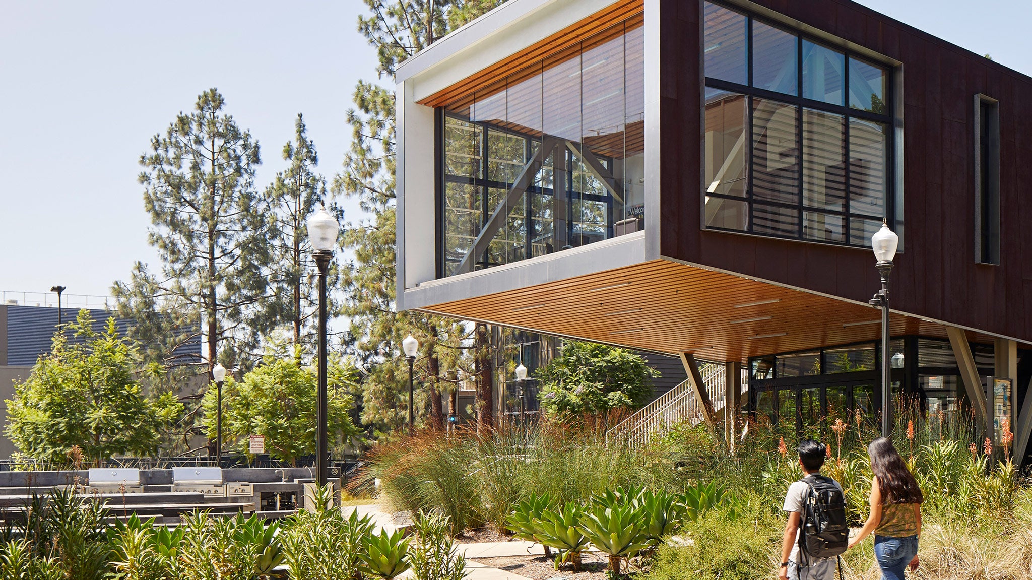 Students walk past undergraduate housing known as Saxon Suites.